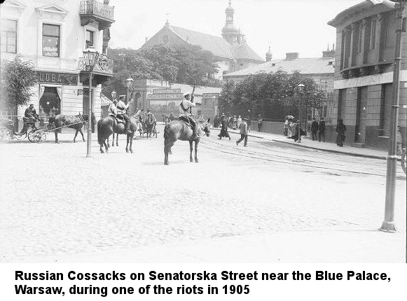 Black & white photograph of men in white uniforms with rifles standing guard near pedestrians on a Warsaw city street